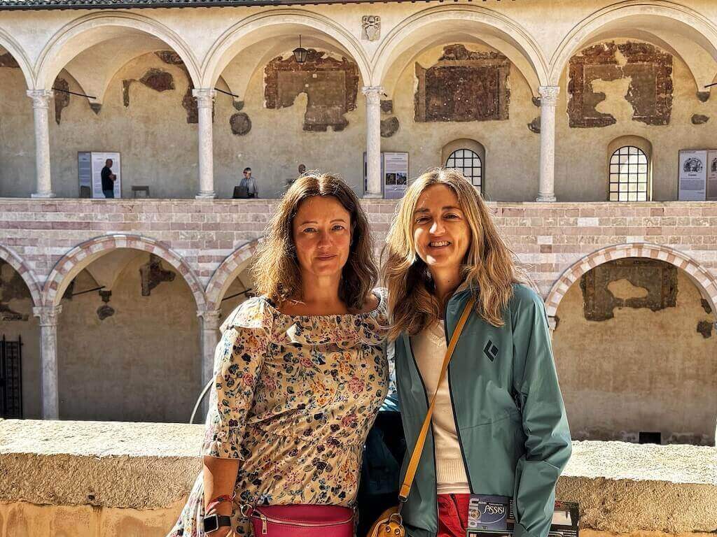 In the Basilica di San Francesco cloister with my sister.