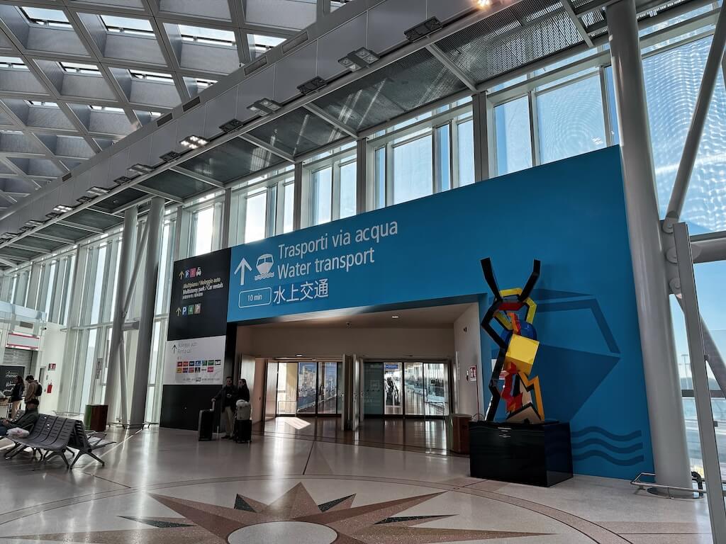 Signs pointing the way to water transport terminal in Venice Marco Polo Airport