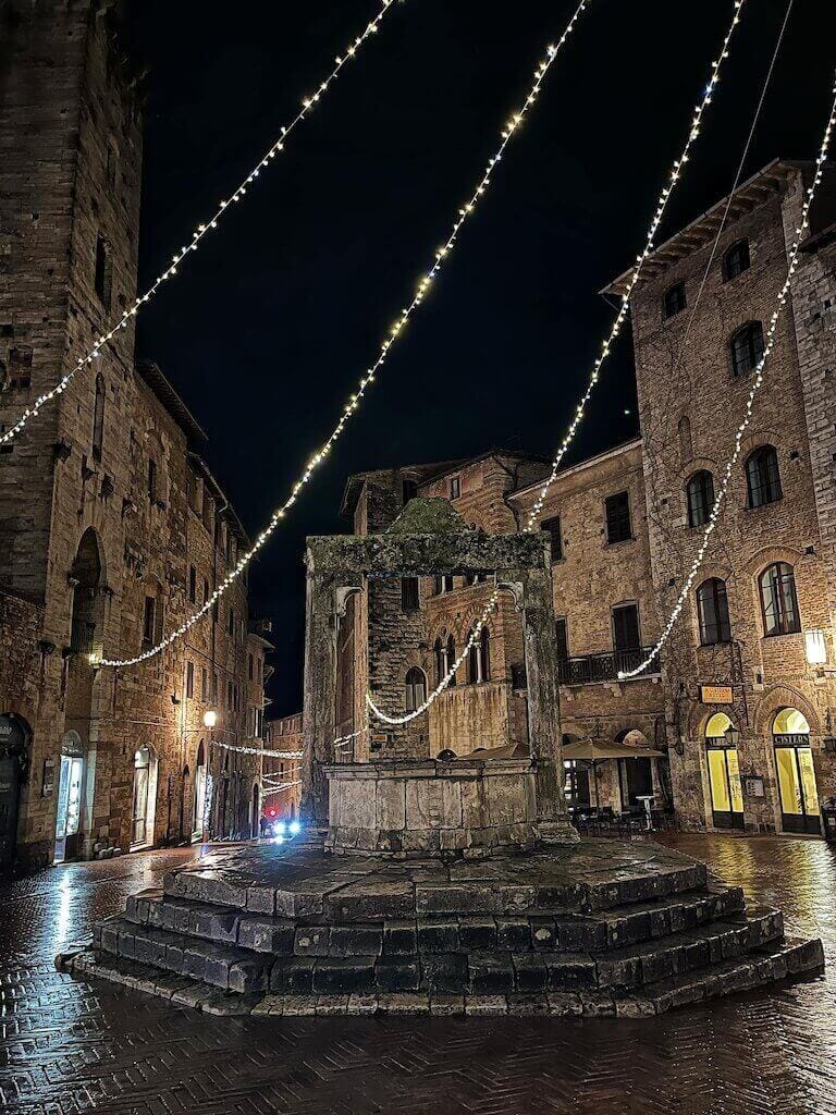 San Gimignano Piazza della Cisterna at night.