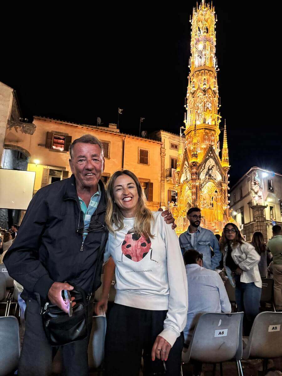 My dad and I posing under the Macchina di Santa Rosa in Viterbo