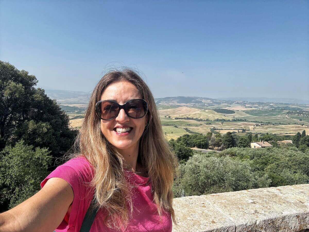 Posing for a selfie with views of the Val d'Orcia in Pienza Italy.