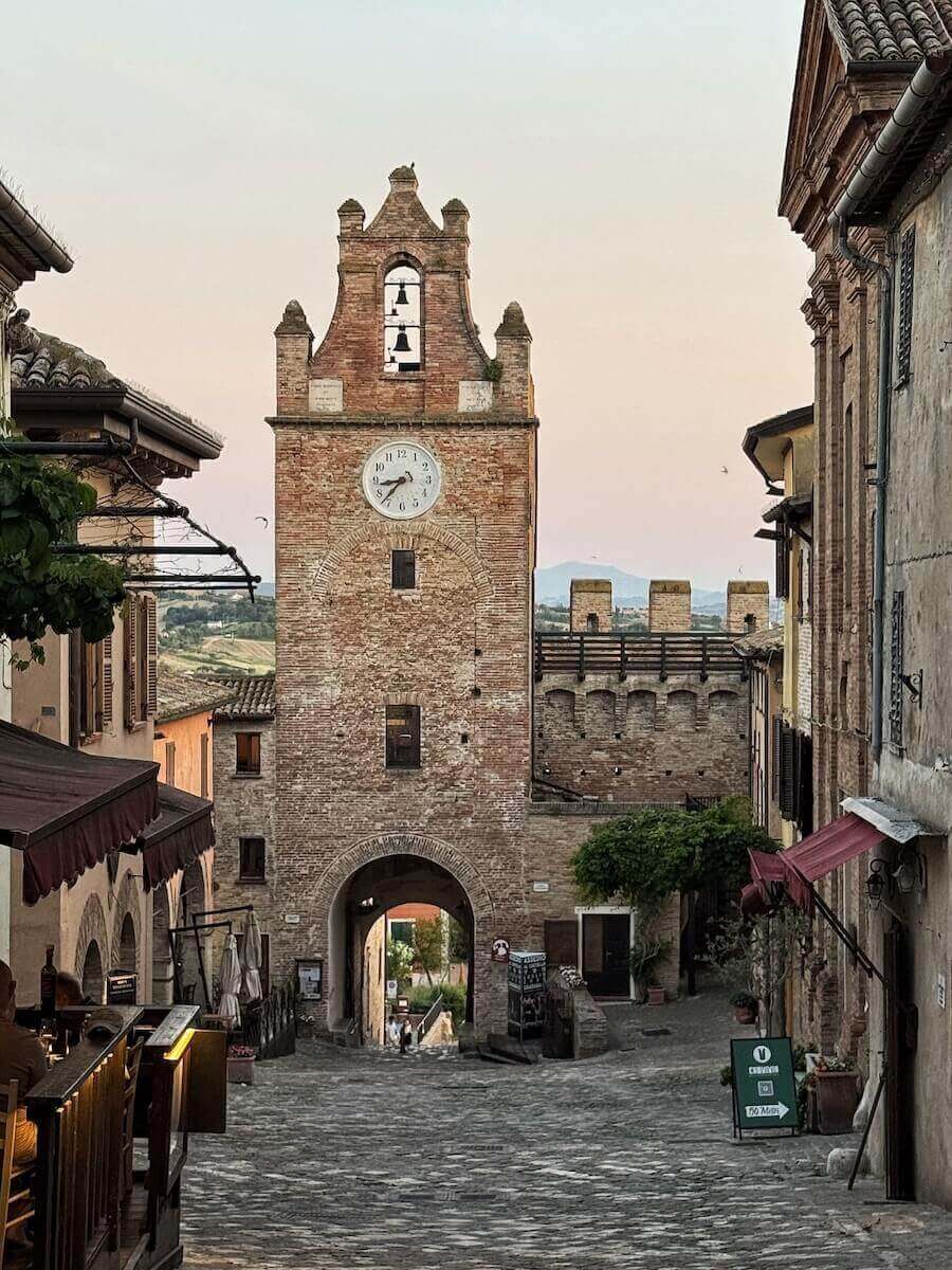 Clock tower in Gradara at sunset.